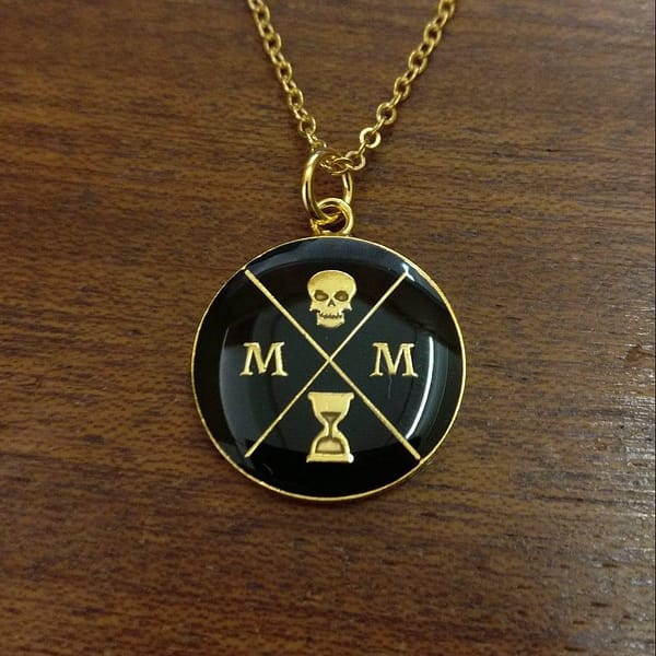 memento-mori-logo-pendant-black-and-gold-front
